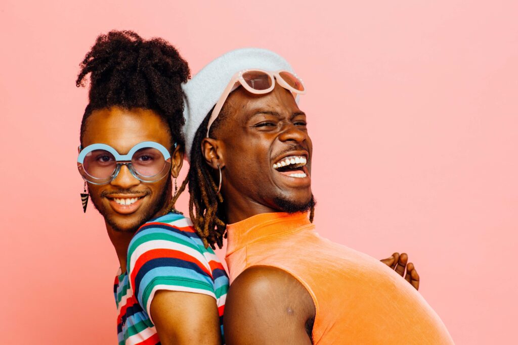 Portrait of a gay couple with big smiles